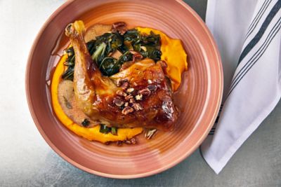 A bowl of brightly colored food on a table