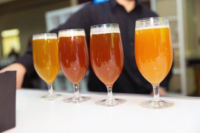 A flight of beers on a bar