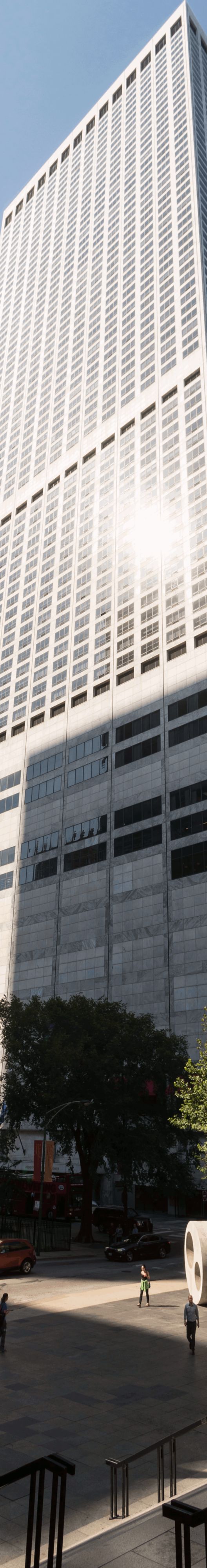 A tall building rises above a paved plaza