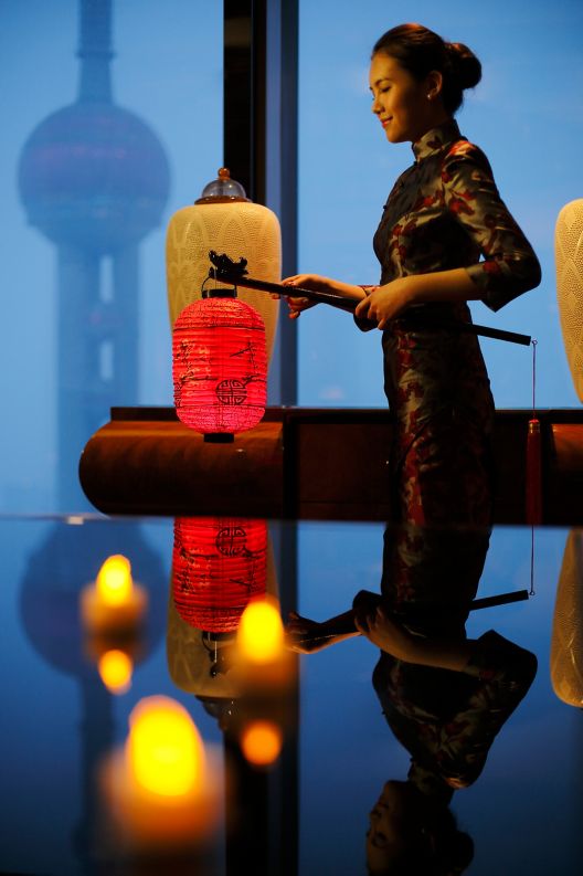 Woman holding a Chinese lantern.