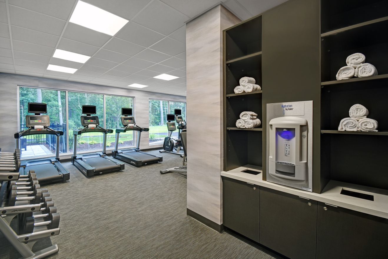 fitness center with water station, workout machine
