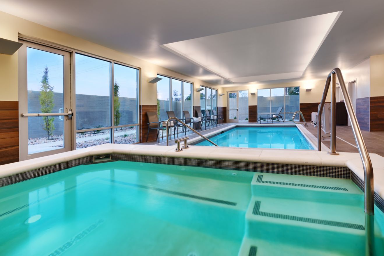 hotel indoor hot tub with pool in background
