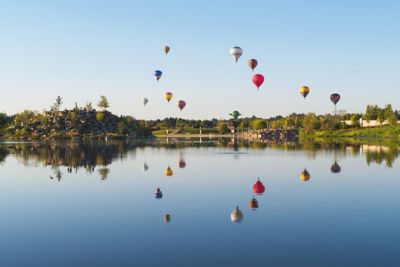 Hot air balloons over a lake