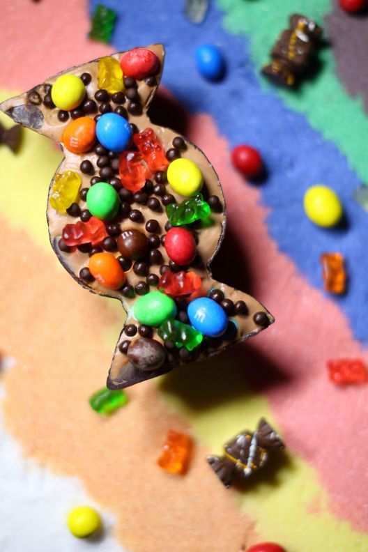 A kids dessert with various chocolates and candies.