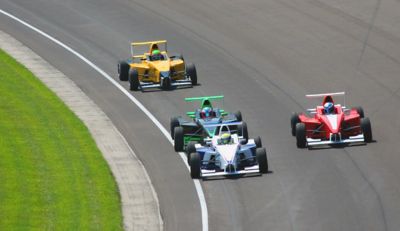 Four race cars on a race track