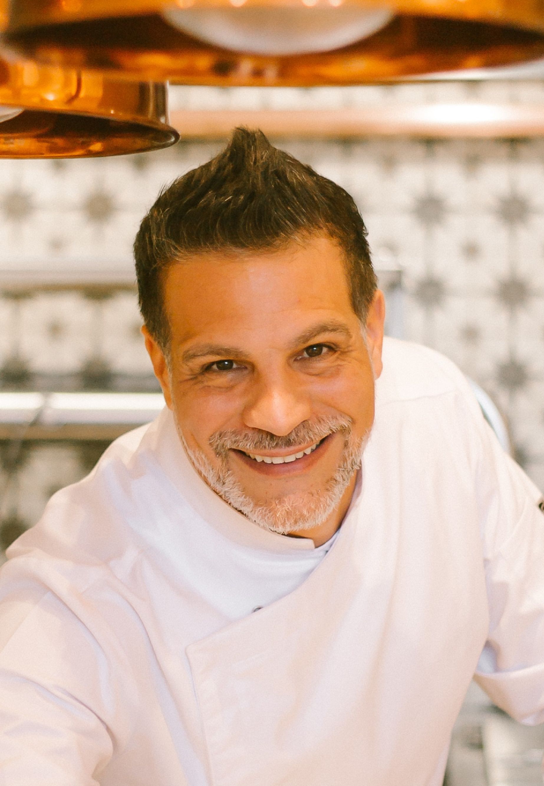 Chef Angelo Sosa smiling at camera