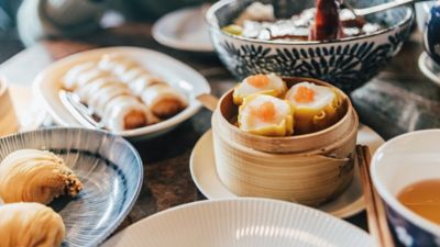 A table topped with dim sum