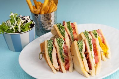 Plat with large sandwich and French fries