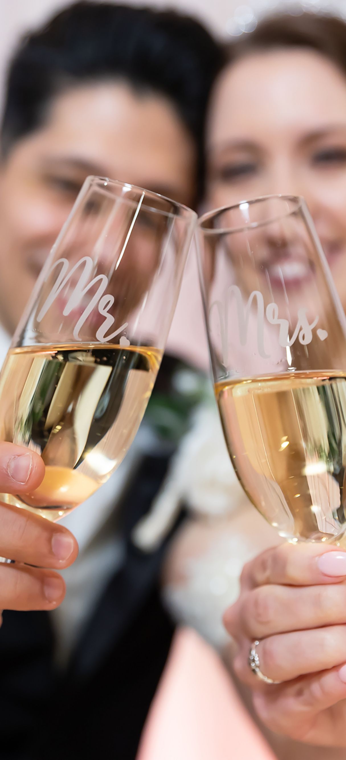 Bride and groom toasting with champagne