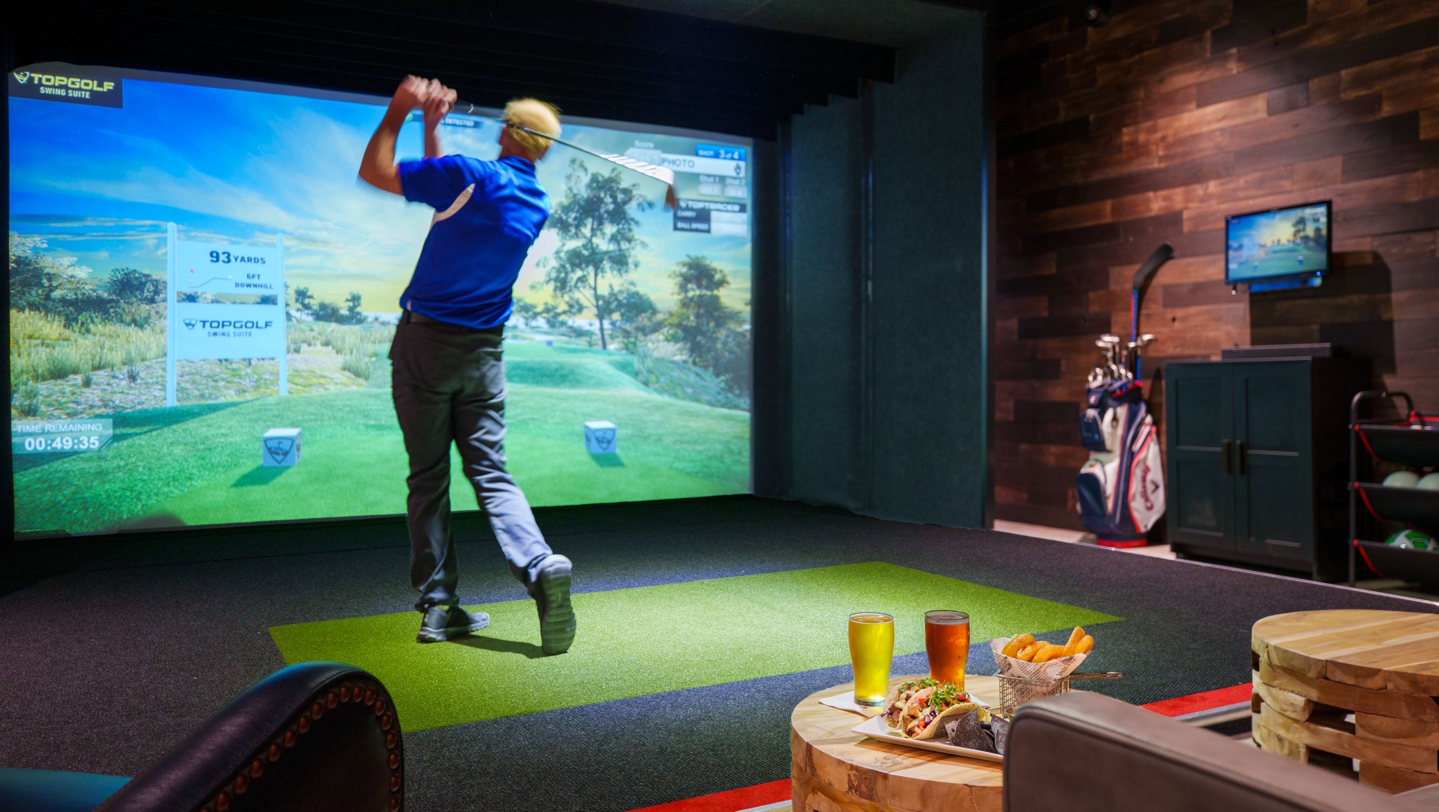 topgolf swing suite with golfer