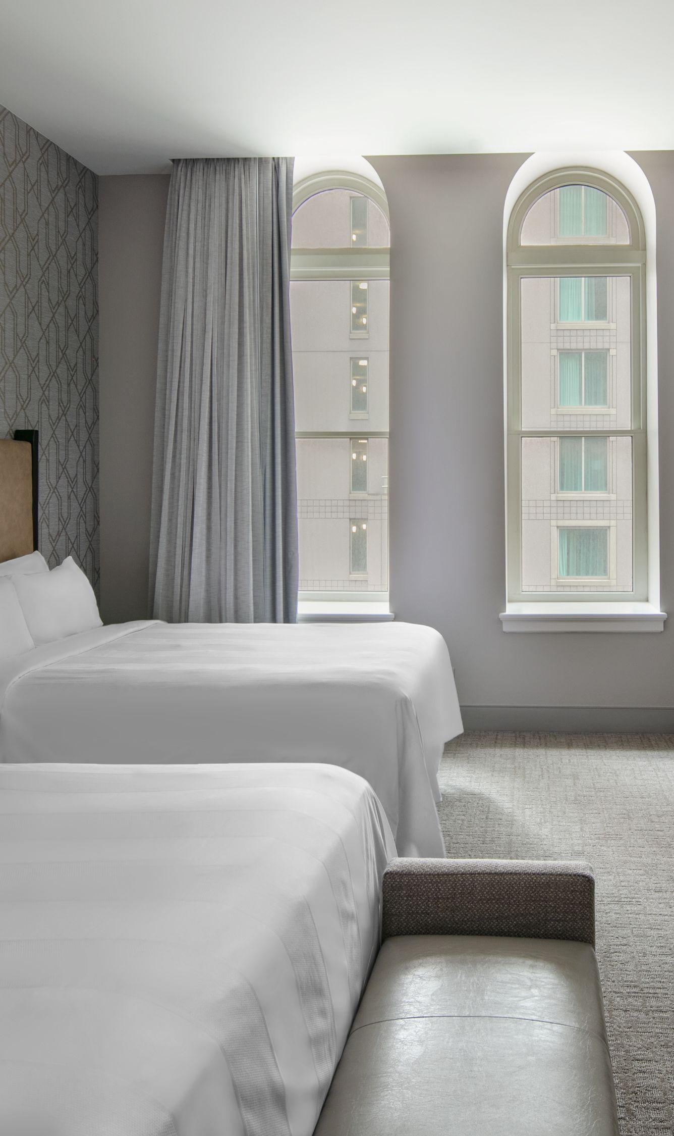 two queen beds desk tv