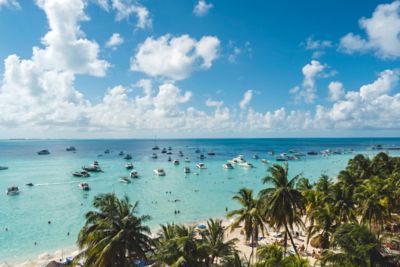 Aerial view of a sandy beach with boats