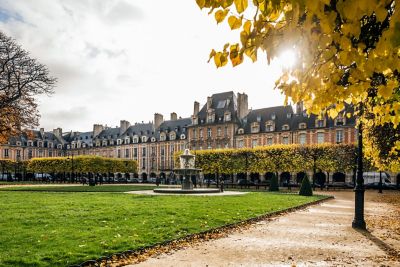 A neighborhood square surrounded with fall foliage
