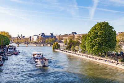 A tourist boat heads down the Seine
