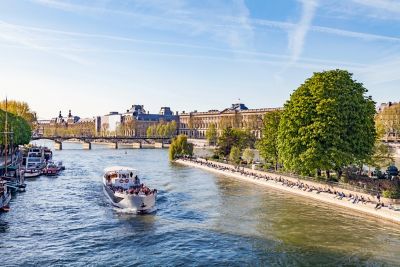A tourist boat heads down the Seine