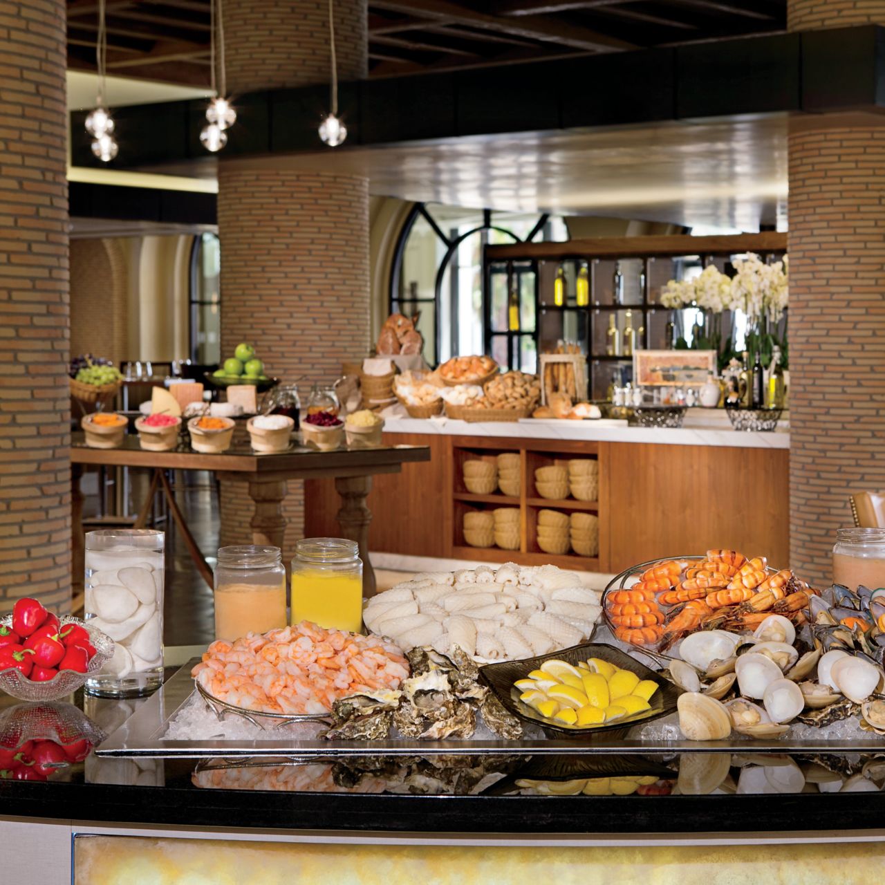 Buffet display of shrimp, seafood, citrus, drinks and more