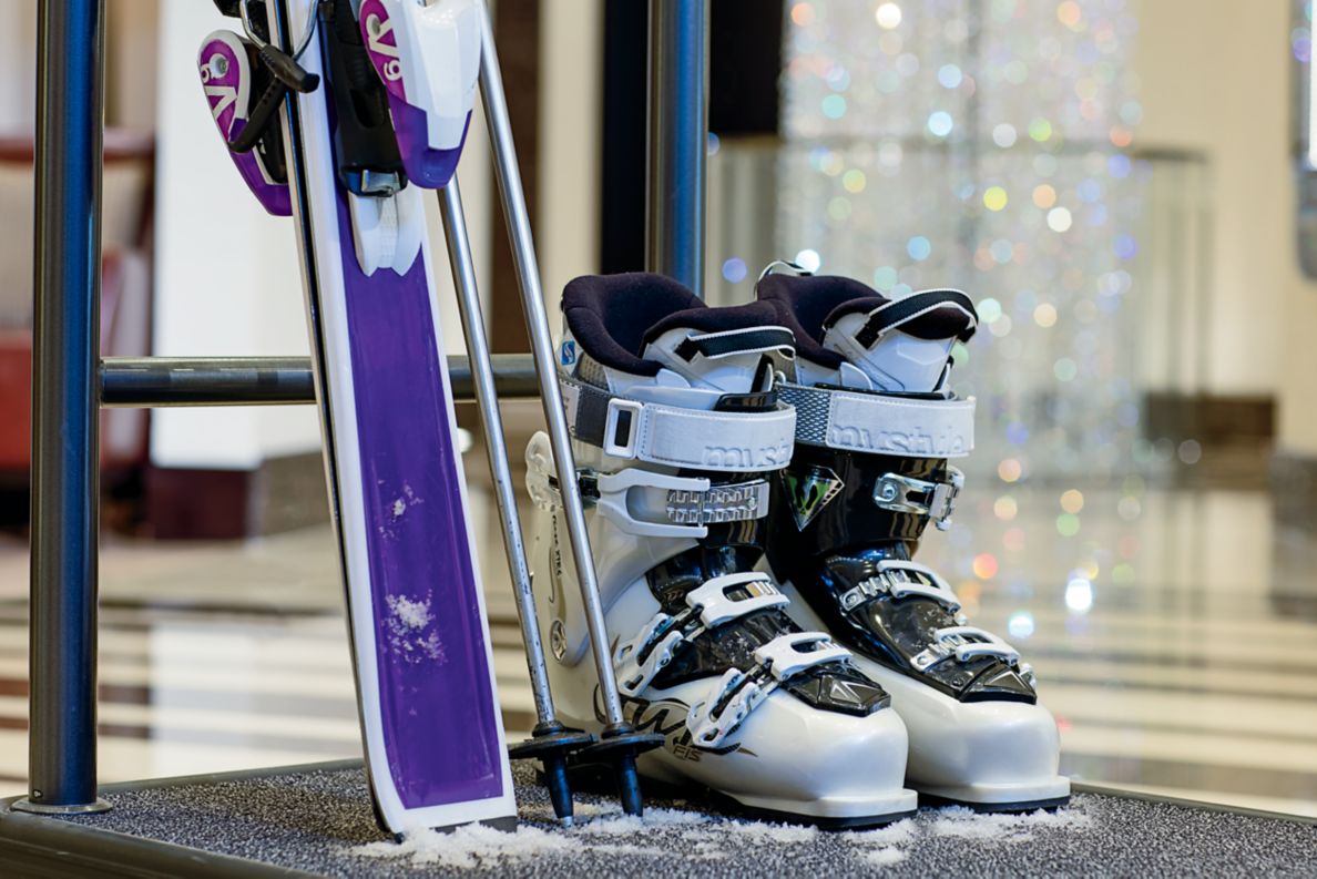Ski's next to some ski boots.