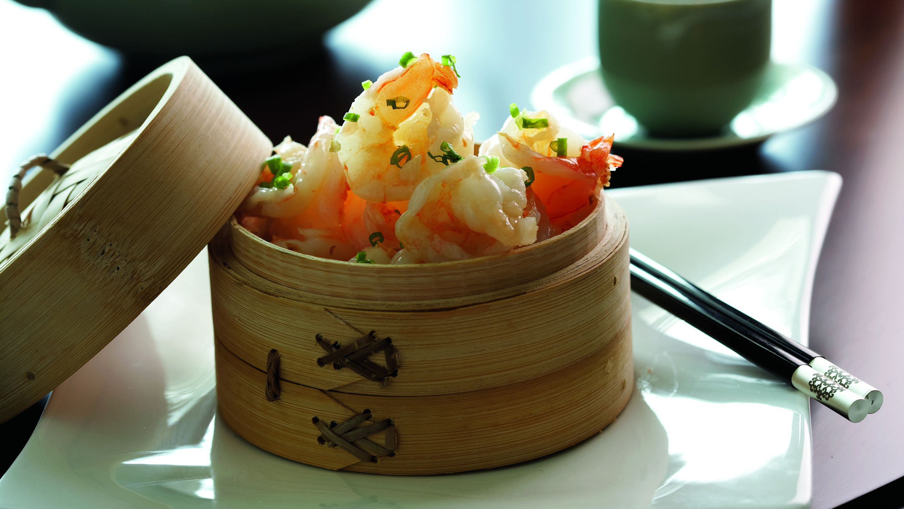 A wood basket of shrimp dumplings