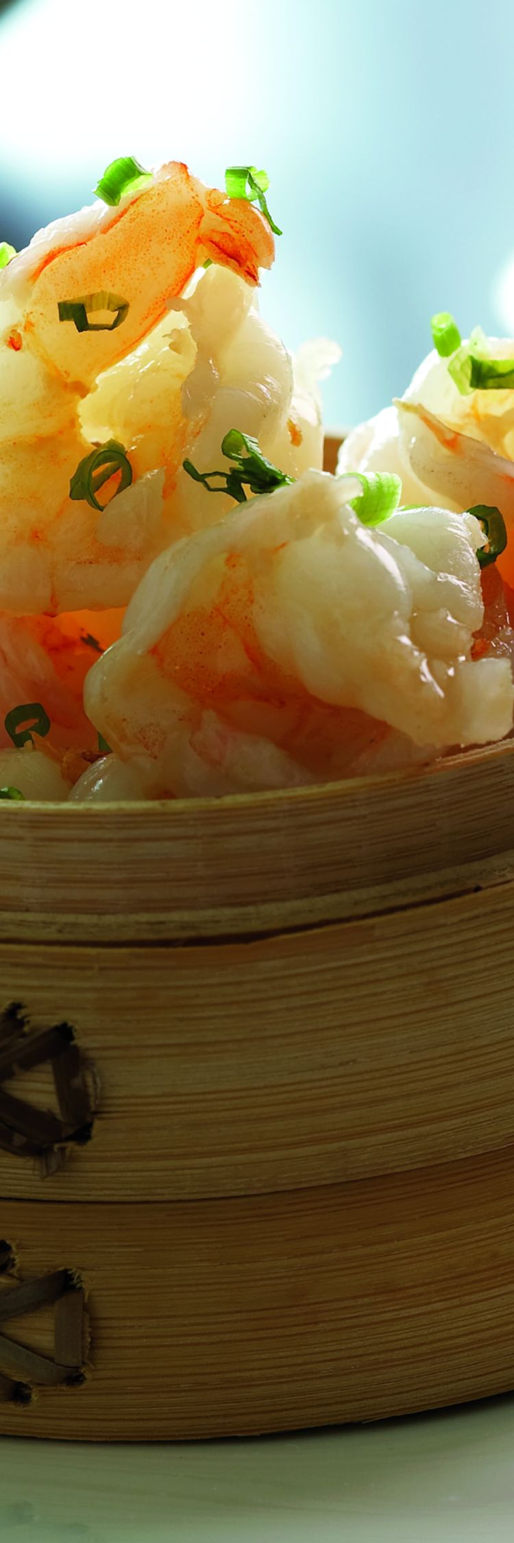 A wood basket of shrimp dumplings