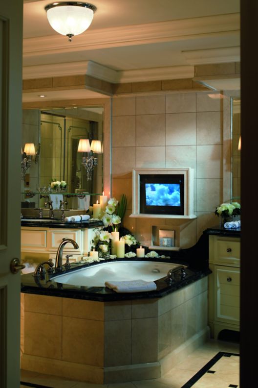 Luxurious soaking tub and TV