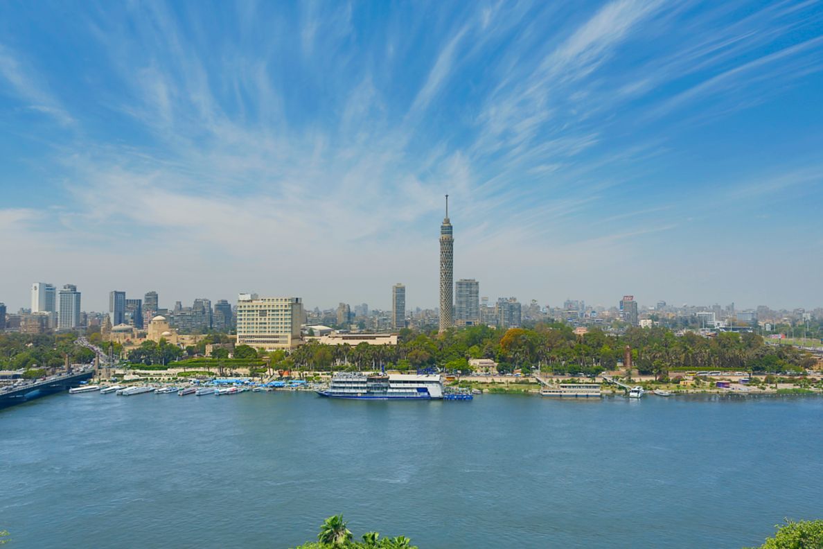 View of the mighty Nile and city skyline under bright blue skies