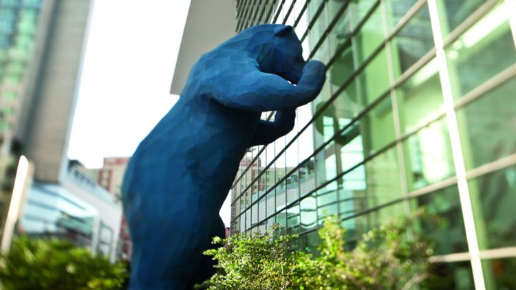 A magnificent blue bear statue seems to peer inside the Colorado Convention Center