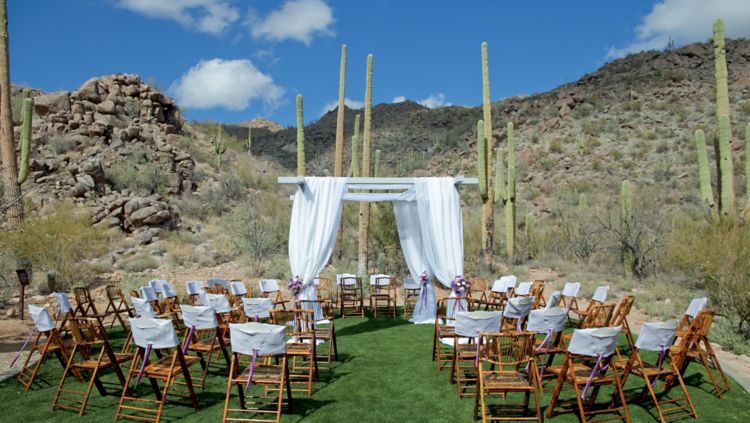 A gazebo and rows of chairs in the desert