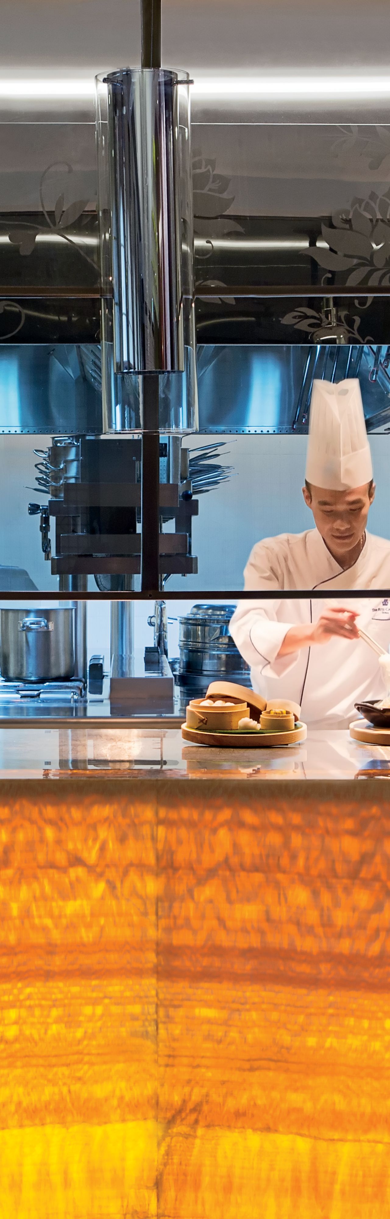 Restaurant chefs at work in Blue Jade?s open kitchen