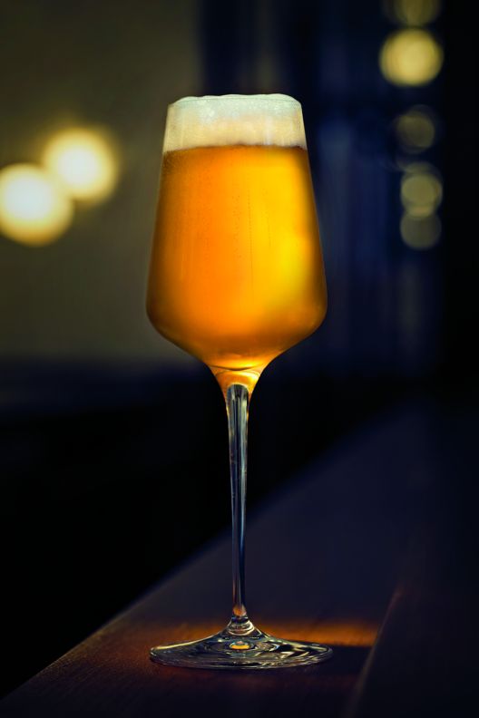 A beer in a tall glass.