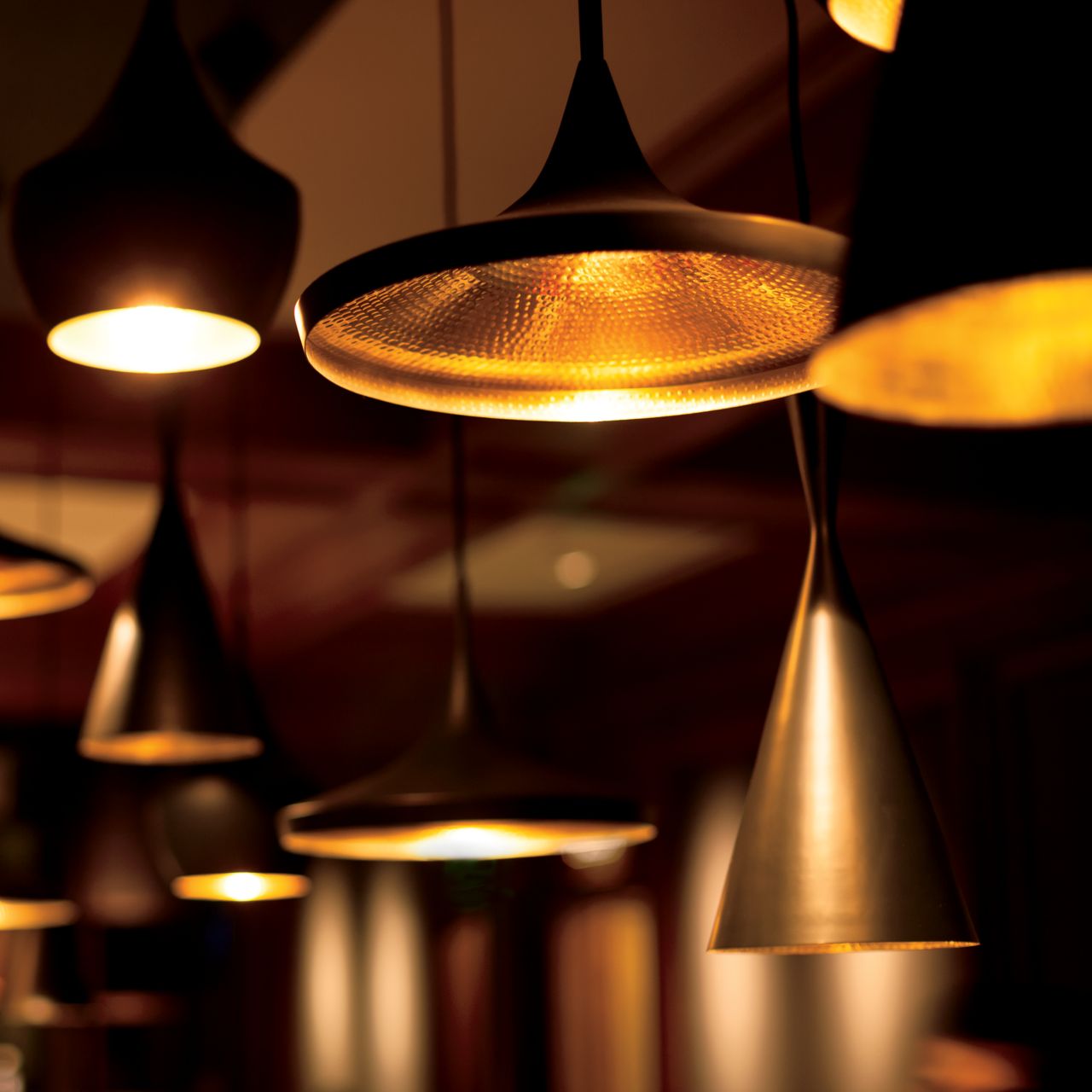 Close-up of hanging lamps of different shapes and sizes