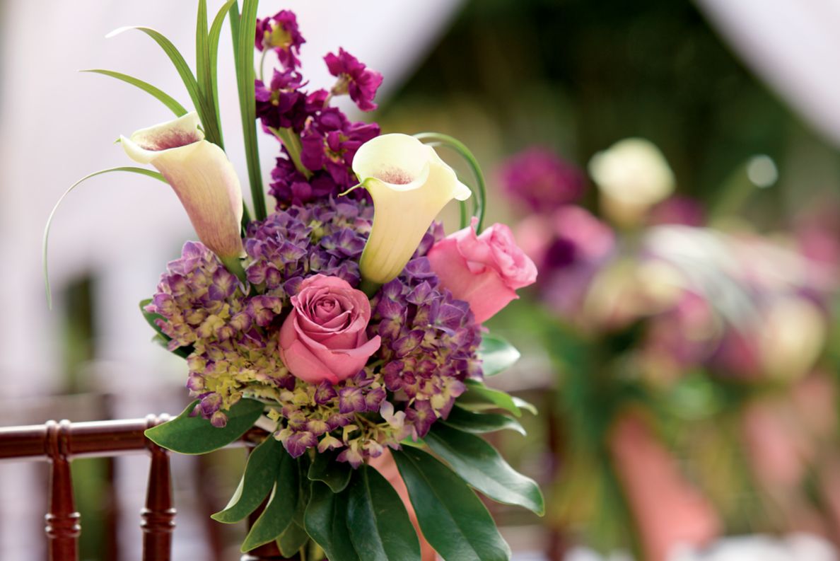 An exquisite selection of blooms adds color and meaning to a wedding reception.