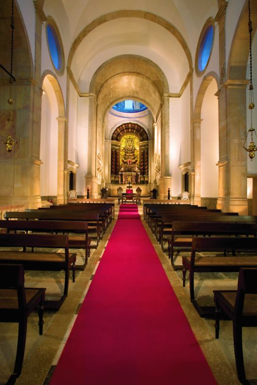 Chapel with a red runner down the aisle. 
