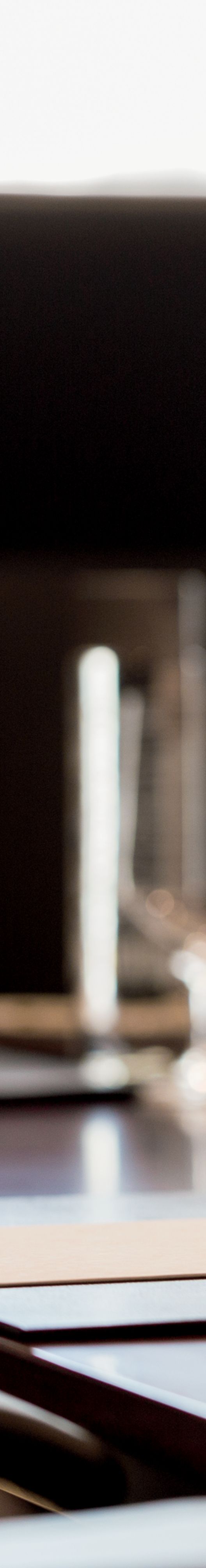 Water bottles and glasses on a meeting table.