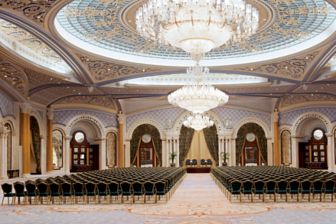 Vast ballroom set up for a business function with theater-style seating