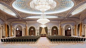Vast ballroom set up for a business function with theater-style seating
