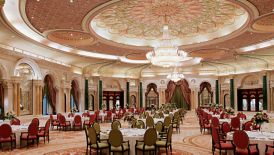 Magnificent ballroom set up with round, banquet-style tables and seating