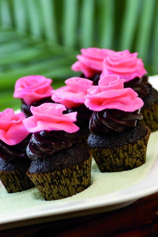 Plate of chocolate cupcakes with frosting. 