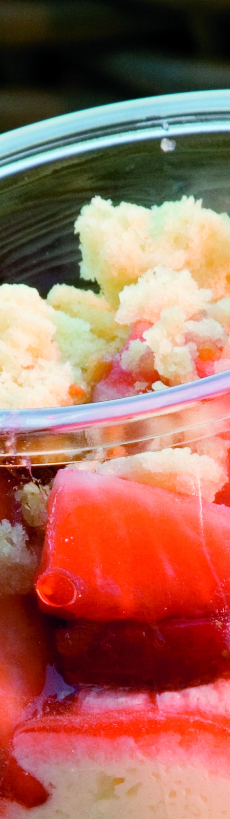 Glass with strawberries, ice cream and cake pieces