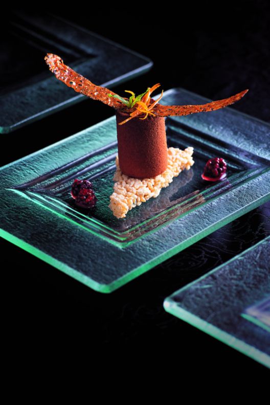 Chocolate dessert on glass plate. 
