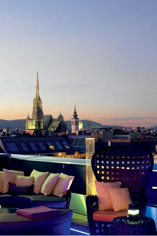 Rooftop bar at sunset with Vienna in the background. 