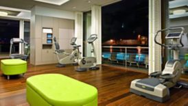 Sleek lime green benches add a punch of decorative vitality to the fitness center