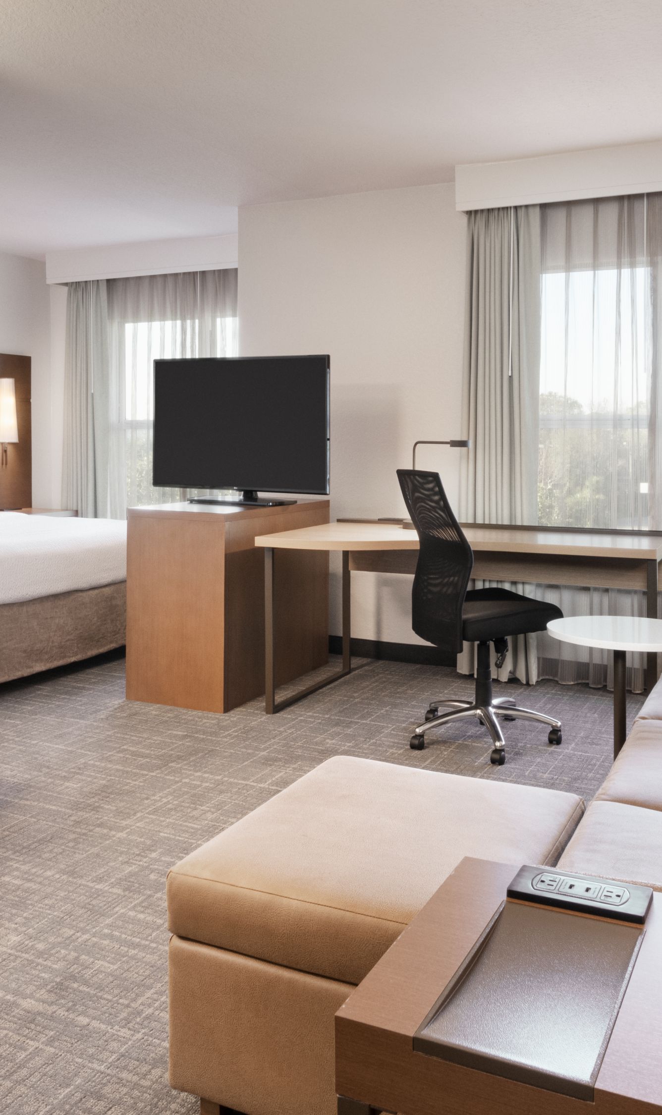 studio living room with bed, table & sofa 