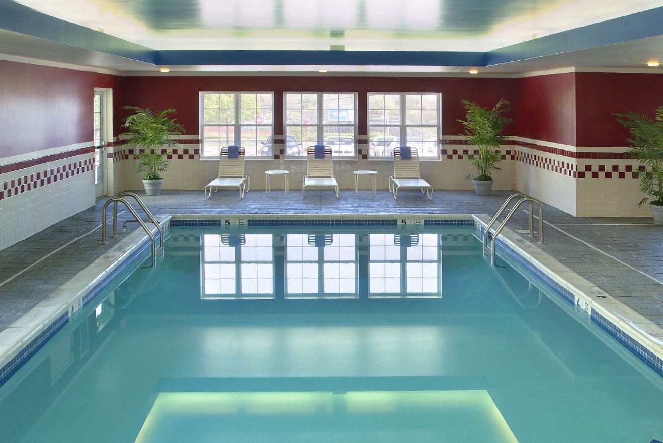 Indoor pool with pool chairs and towels