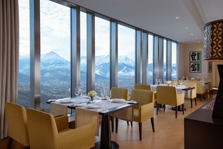 A restaurant with a view towards the mountains.