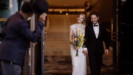 Wedded couple walking through hotel