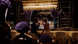 Wedded couple by the bar