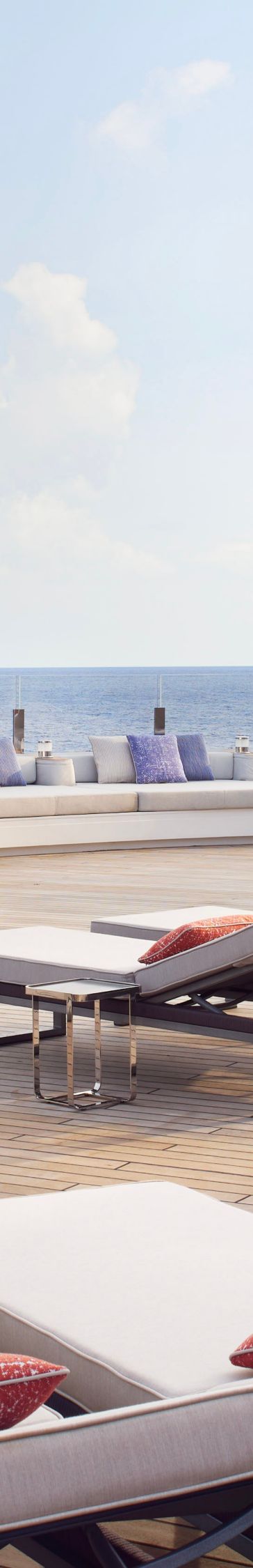 Lounge chairs line a yacht's deck 