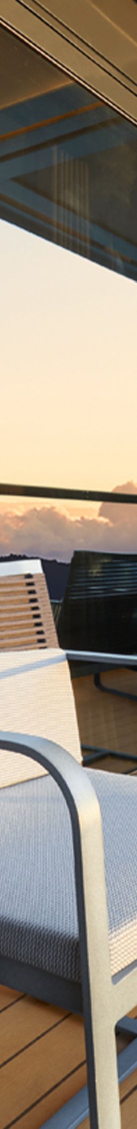 Two lounge chairs on the terrace of a yacht cabin