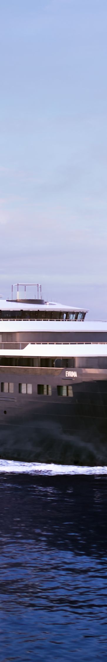 A yacht moves through the ocean