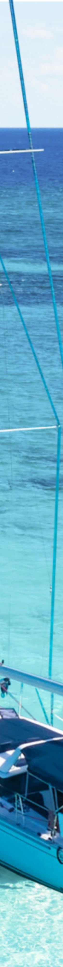 A sailboat drops anchor in the Caribbean Sea
